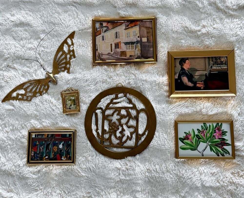 Brass gallery wall, art prints in brass frames, vintage solid brass hangings